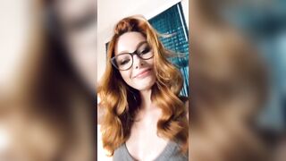 Sexy redhead in glasses